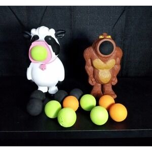 Cow Shooter Popper Hog Wild and Big Foot Sasquatch lot of 2 with 13 foam balls